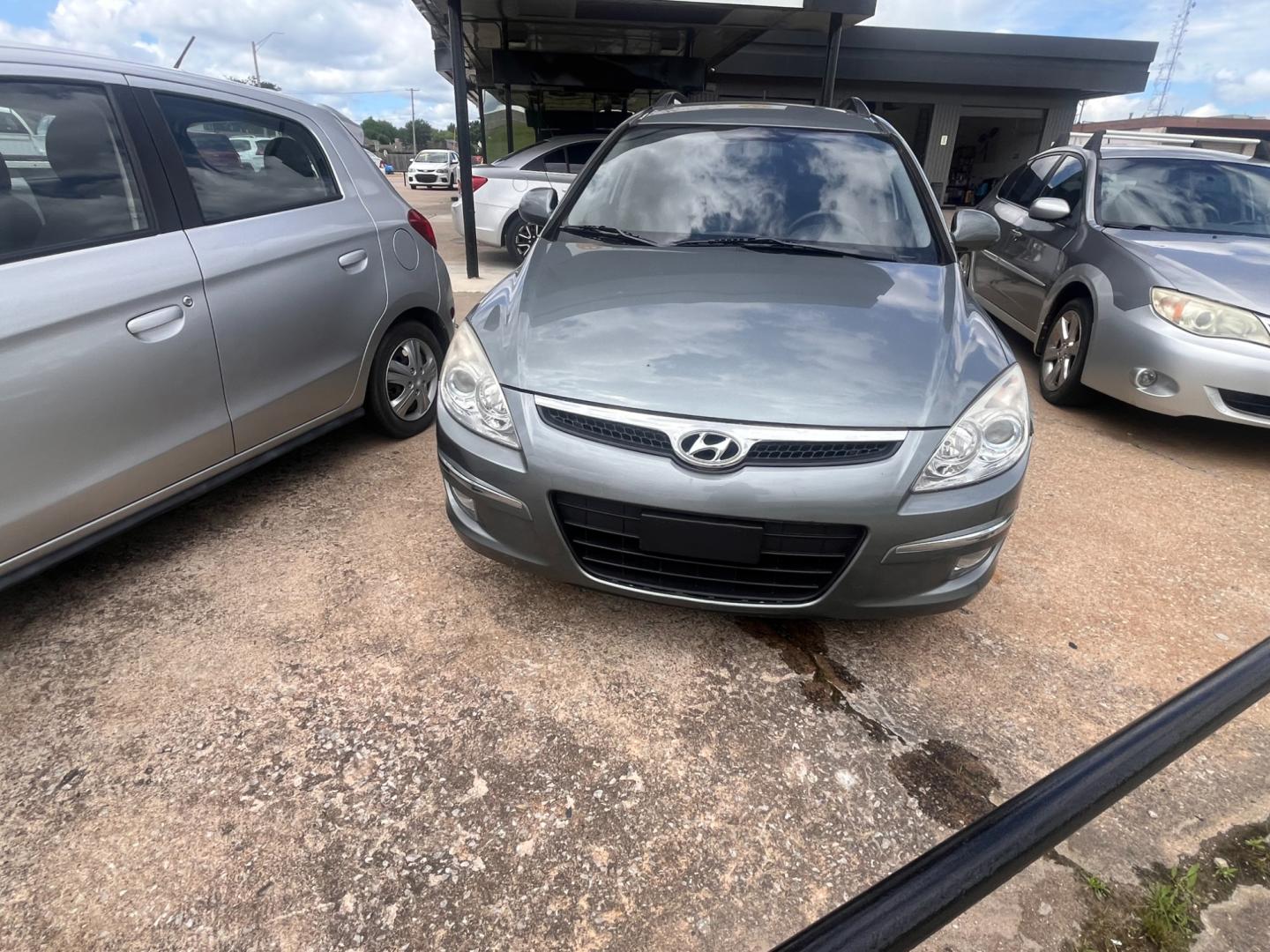 2010 GRAY HYUNDAI ELANTRA TOURING GLS; GLS Automatic (KMHDC8AE3AU) with an 2.0L L4 DOHC 16V engine, 4-Speed Automatic transmission, located at 8101 E. Skelly Dr., Tulsa, OK, 74129, (918) 592-3593, 36.121891, -95.888802 - Photo#3